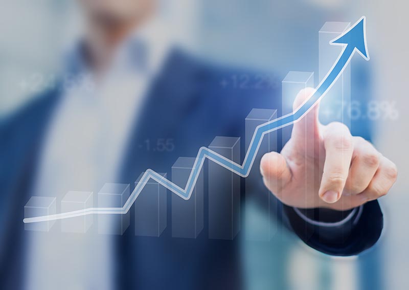 Business professional presenting a growth chart