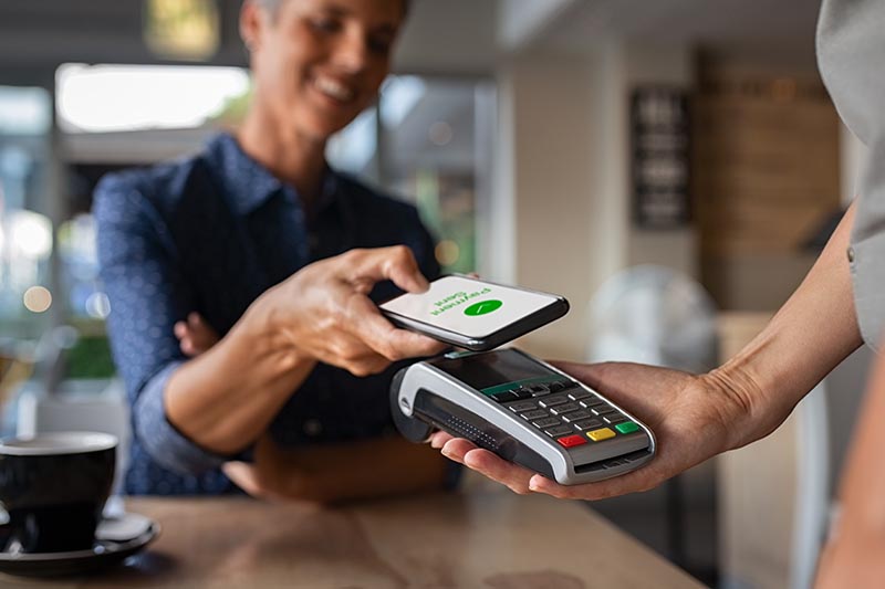 Customer making a contactless payment